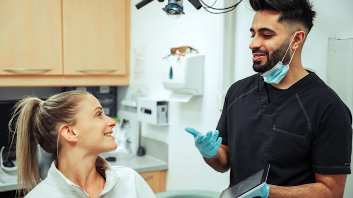 Orthodontist discussing treatment cost with patient