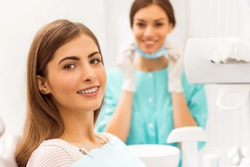 Adult patient consulting orthodontist about treatment cost